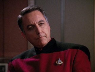 Man red uniform serious look - his face and chest free wallpaper