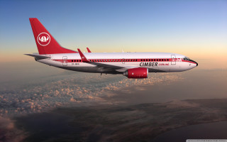 Jetliner flying cloudy sky above 2 - a cloudy sky above the clouds free wallpaper