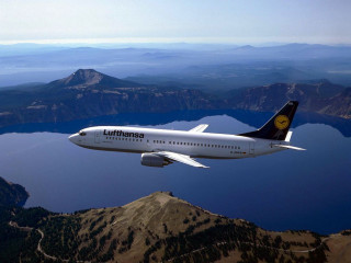 Jetliner flying mountains lake sky - a lake and mountains free wallpaper