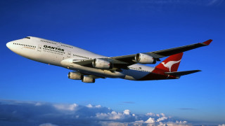 Passenger jet flying blue sky - a kangaroo free wallpaper