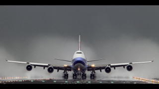 Jetliner takeoff dark clouds landing - an airport runway free wallpaper