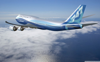 Large jetliner blue sky clouds 5 - below free wallpaper