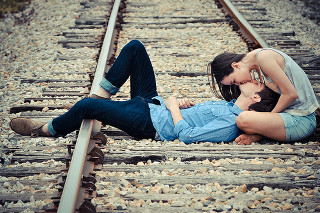 Romantic traintracks kiss beach ocean - a train track in the background free wallpaper