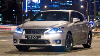 White car night city lights 5 - the background and a street light in the foreground free wallpaper