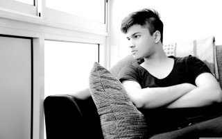 Man sitting couch arms crossed 3 - his head free wallpaper