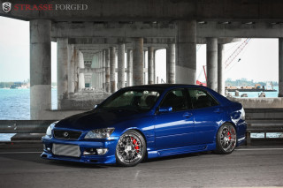 Blue car parked bridge water - refined free wallpaper