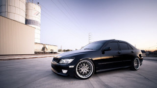 Black car parking lot building 5 - a black car free wallpaper