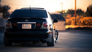 Black car parking lot sunset 3 - a license plate free wallpaper