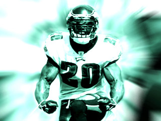 Football player running ball blurry - a football player free wallpaper