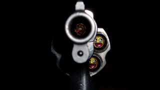 Gun smiley face barrel cap - a gun in the foreground free wallpaper