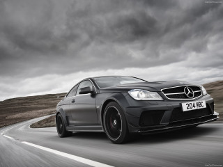 Mercedes c6 amg driving road - a black car in the foreground free wallpaper