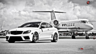 White car parked jet airliner - a plane in the background free wallpaper for desktop