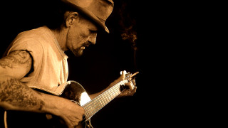 Man hat guitar dark cigarette - his mouth and a cigarette free wallpaper
