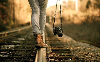 Person walking train track camera - photographic free wallpaper