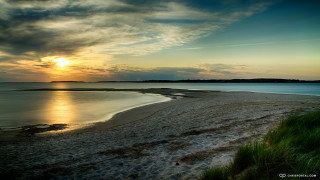 Beach sunset water grass shore - widescreen free wallpaper
