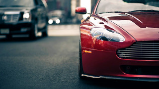 Red car parked road next - the side of a road next free wallpaper