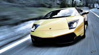 Yellow sports car blurry road - a yellow sports car free wallpaper