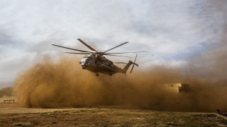 Helicopter dirt field cloudy sky - dust free wallpaper