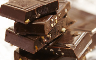 Chocolate bars stack table top - decadent free wallpaper for desktop
