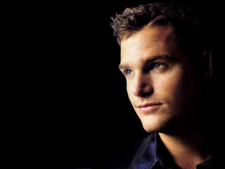 Man black shirt serious look 9 - free portrait wallpaper for desktop