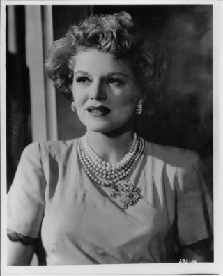 Woman necklace pearls black white - a curtain behind her free wallpaper for mobile