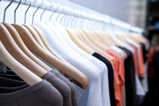 Rack of clothes hanging wall - fashion free wallpaper
