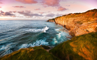 Boat cliff water bascove beach - a cliff in the background free wallpaper