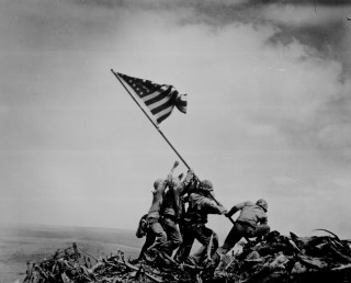 Men raising flag hill rubbles 2 - top of a hill free wallpaper