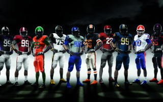 Football players standing helmets hands 2 - a group of football players free wallpaper
