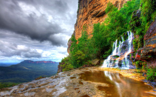 Waterfall cascading valley mountain background - a valley free wallpaper