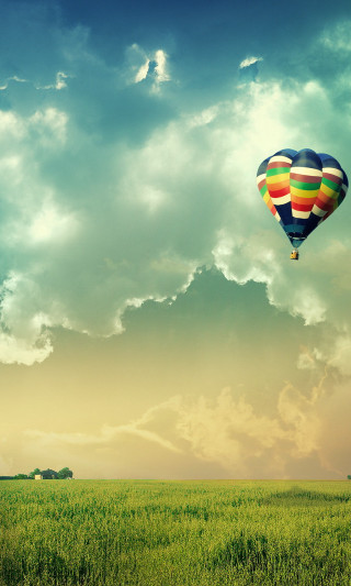 Hot air balloon cloudy sky - magical realism free wallpaper for mobile