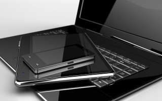 Laptop on black laptop next - smaller free wallpaper