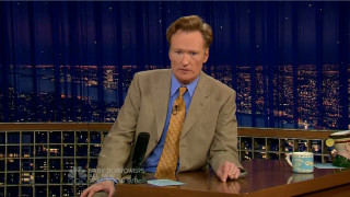 Man suit tie desk microphone - a cup of coffee in front free wallpaper