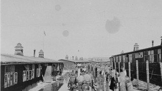 People walking street buildings flagpole - promotional free wallpaper for desktop