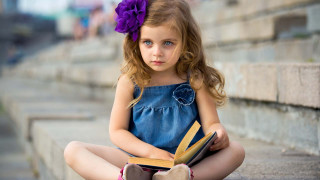 Little girl sitting book lap - a little girl free wallpaper for desktop