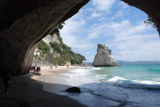 Beach people ocean cave rock - a sandy beach next free wallpaper