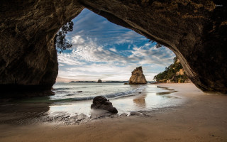 Beach cave person cloudy ocean - a view of the ocean free wallpaper for desktop
