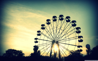 Ferris wheel sunset trees foreground - a ferris wheel free wallpaper