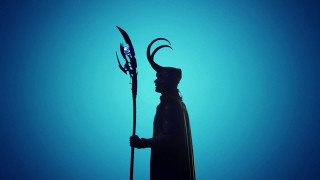 Horned man statue spear image - against a blue background free wallpaper