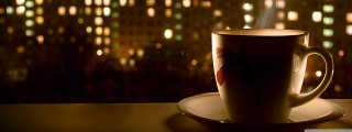Coffee cup saucer window cityscape - a cityscape in the background free wallpaper for desktop