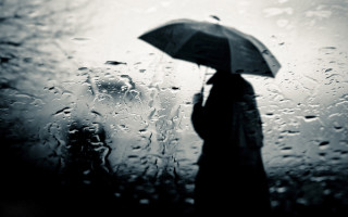 Person standing rain umbrella black - their head free wallpaper