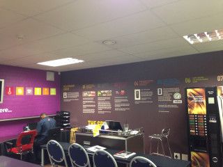 Man sitting desk purple wall - a purple wall free wallpaper