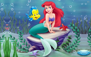 Little mermaid sitting rock fish 2 - her hand and a fish free wallpaper