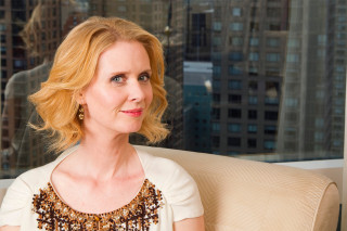 Woman chair cityview window background - feminist free wallpaper for desktop