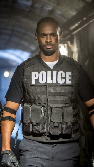 Police officer walking street uniform - a black vest free wallpaper