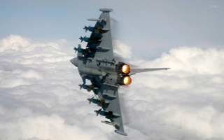 Fighter jet flying above clouds 6 - a fighter free wallpaper