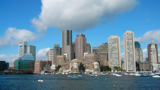 City skyline boats water clouds - a body of water in front free wallpaper for desktop