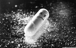 Sad pill water drops black - a wet surface free wallpaper