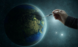 Hand holding paintbrush painting earth - the earth free wallpaper