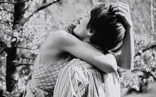 Woman hugging head forest blurry - free love wallpaper for desktop